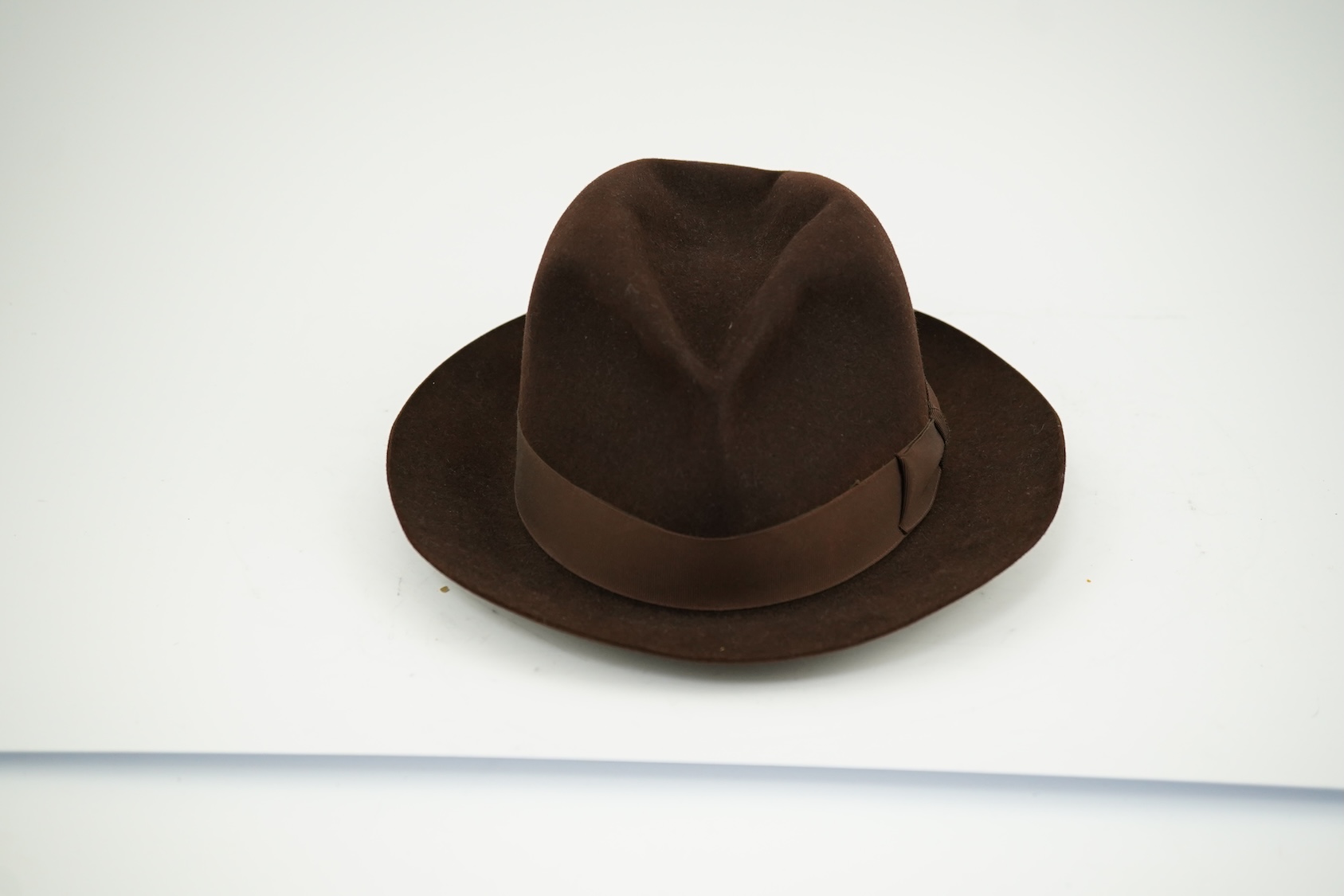 A brown felt Dunn and Co hat Size 56